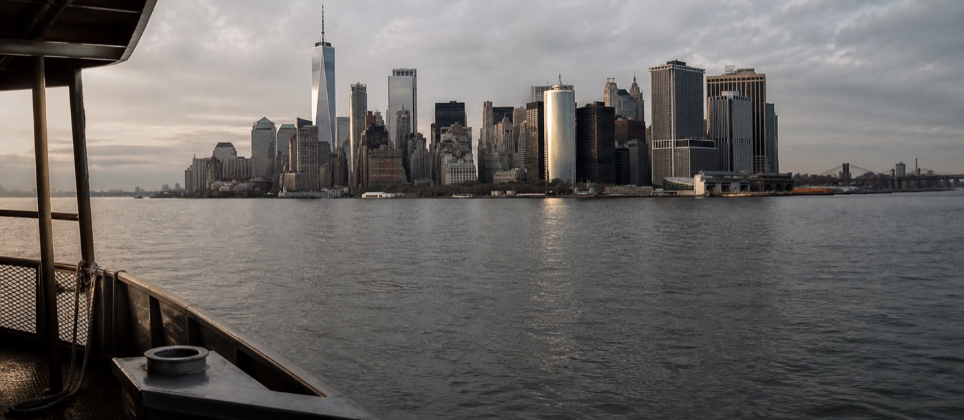 Lower Manhattan beneath clearing evening clouds
