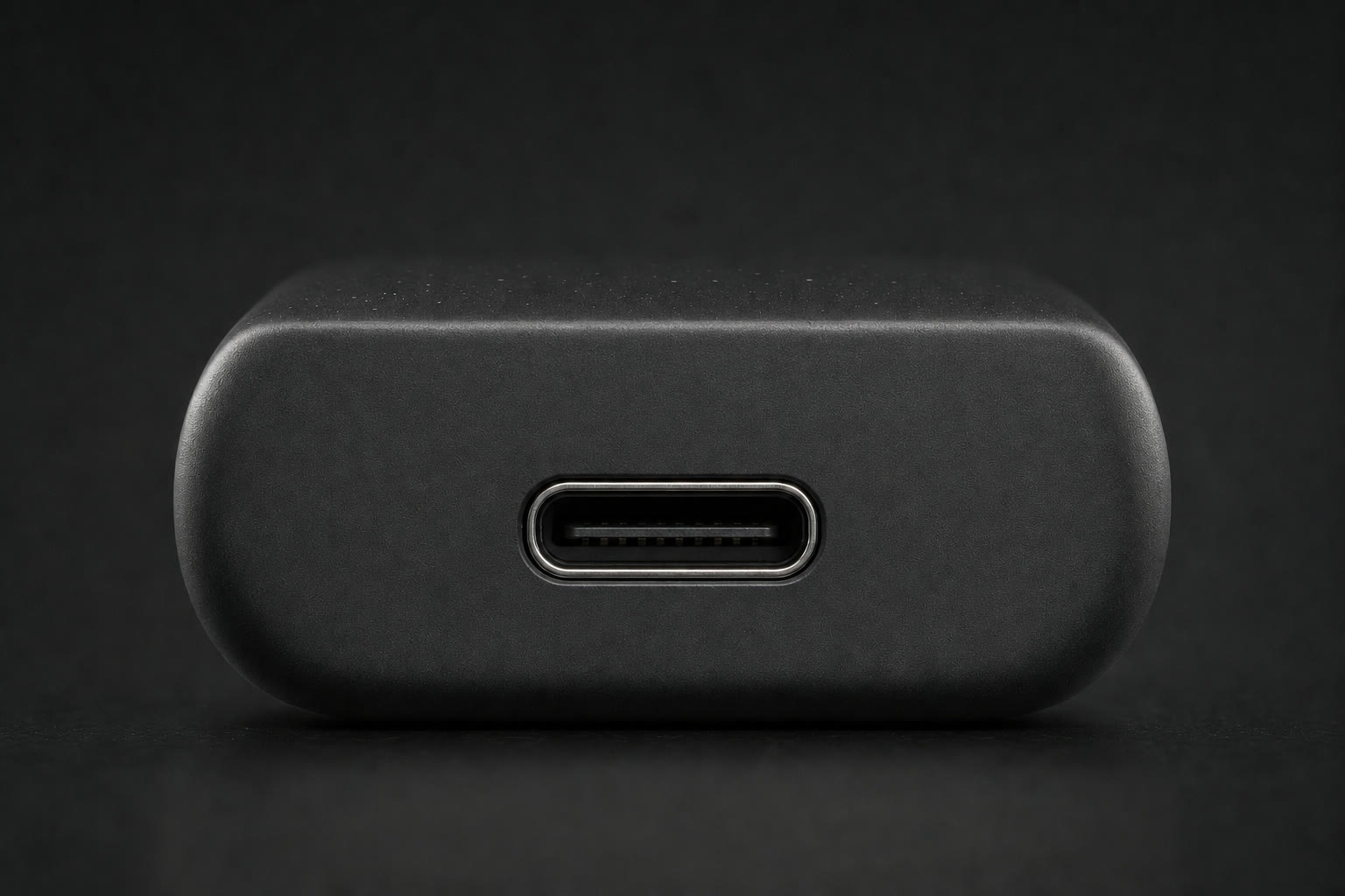 Close V4.3 design-intent study of the centred USB-C port wholly within the bottom end wall