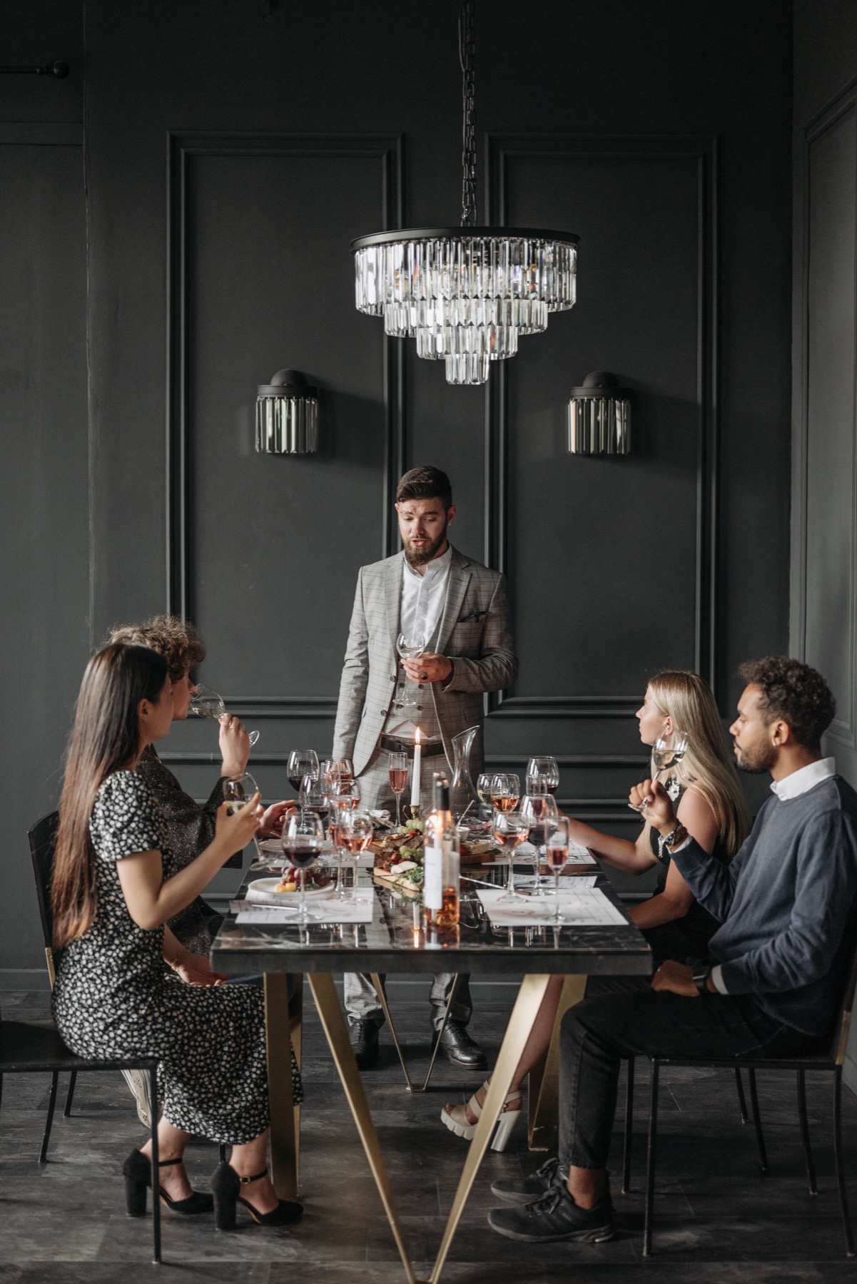 A diverse group sharing a long table